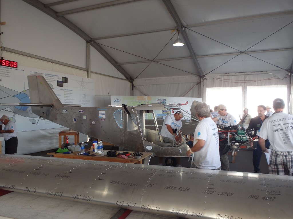 Here we can see the wings completed and the fuselage coming together. Many people had assisted and the clock was counting down.